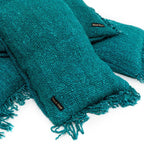 Plaid en coton texturé aqua avec franges, parfait pour la décoration intérieure