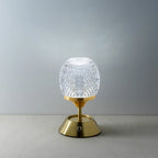 Lampe de table en laiton avec globe en verre facetté transparent