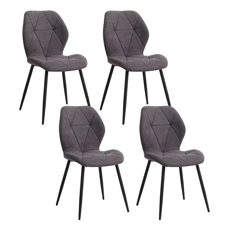 Lot de 4 chaises en tissu gris avec piètement noir, idéales pour une salle à manger moderne.