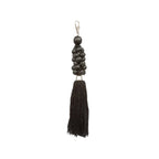 Porte-clés pompon en perles de bois noir avec fermoir argenté