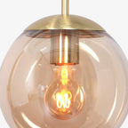 Suspension en verre ambre et métal doré forme sphère ø25 cm