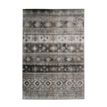 Tapis rectangulaire Ariya 300 Grau avec motif tribal distressed en gris noir et blanc